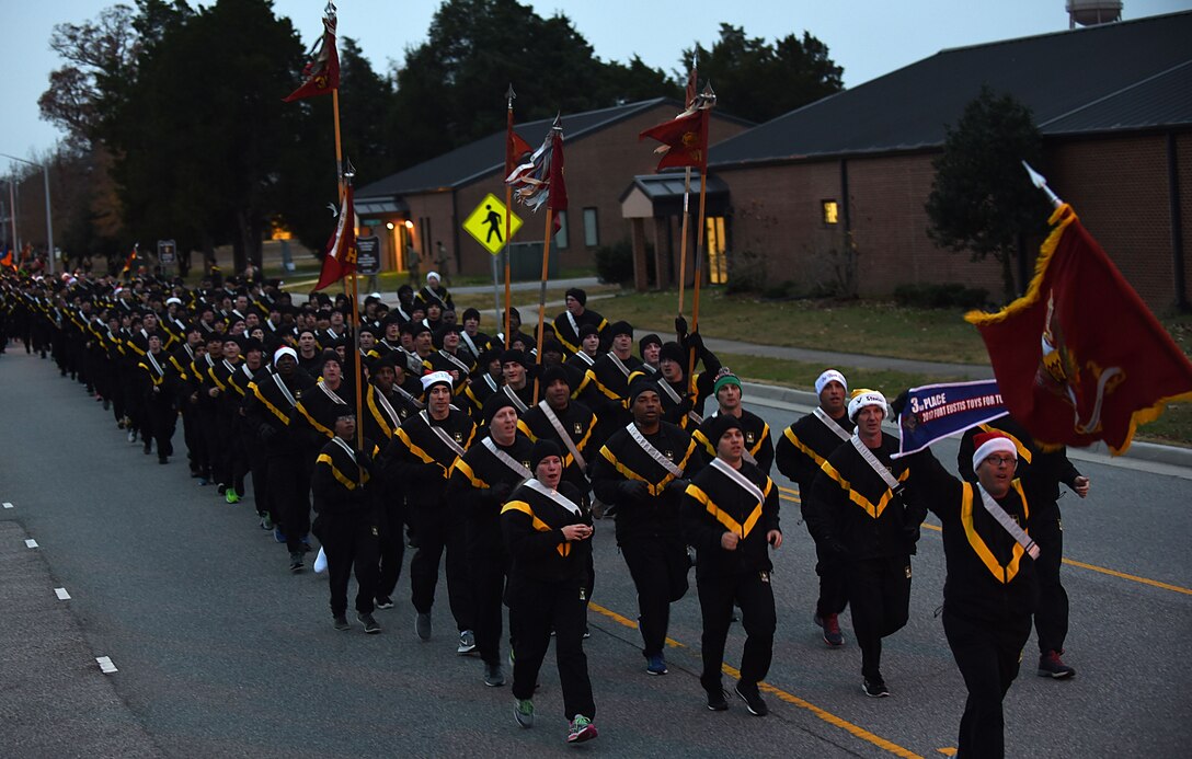 U.S. Army Soldiers run in formation during the annual U.S. Marine Corps’ Toys for Tots run to celebrate the success of the program at Joint Base Langley-Eustis, Va., Dec. 7, 2017.