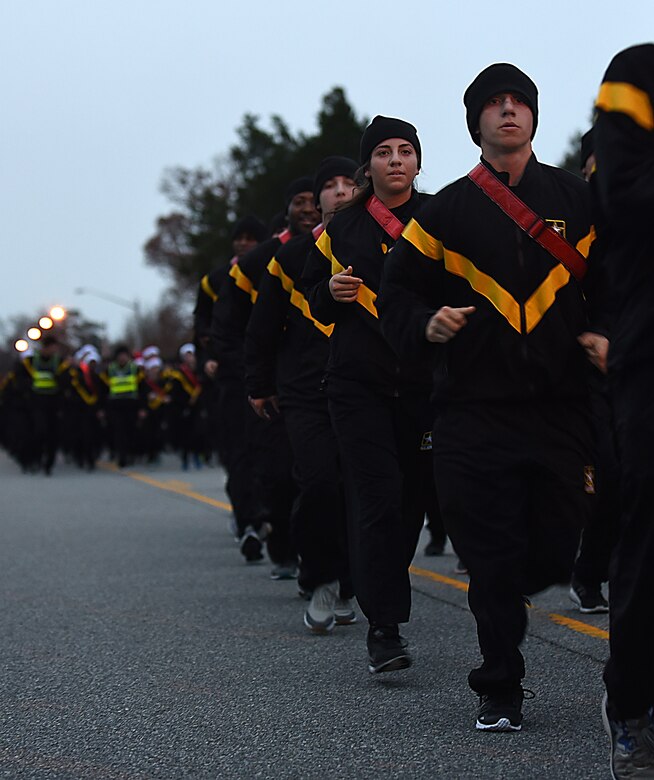 U.S. Army Soldiers run in formation during the annual U.S. Marine Corps’ Toys for Tots run to celebrate the success of the program at Joint Base Langley-Eustis, Va., Dec. 7, 2017.