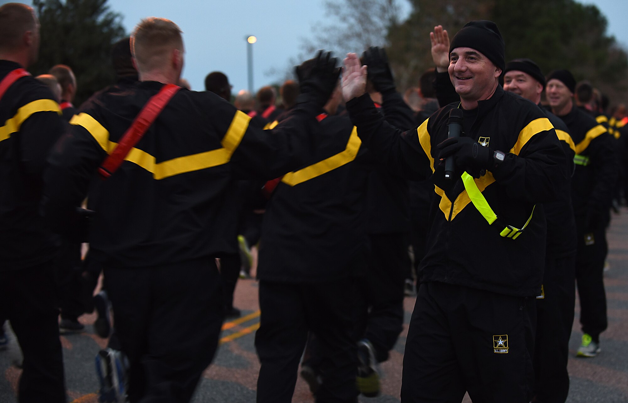 U.S. Army Brig. Gen. Lonnie Hibbard, U.S. Army Training and Doctrine Command Operations, Plans and Training deputy chief of staff, congratulates Soldiers for finishing the U.S. Marine Corps’ Toys for Tots run at Joint Base Langley-Eustis, Va., Dec. 7, 2017.