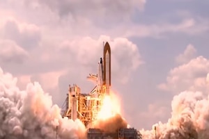 The Space Shuttle launches into space.
