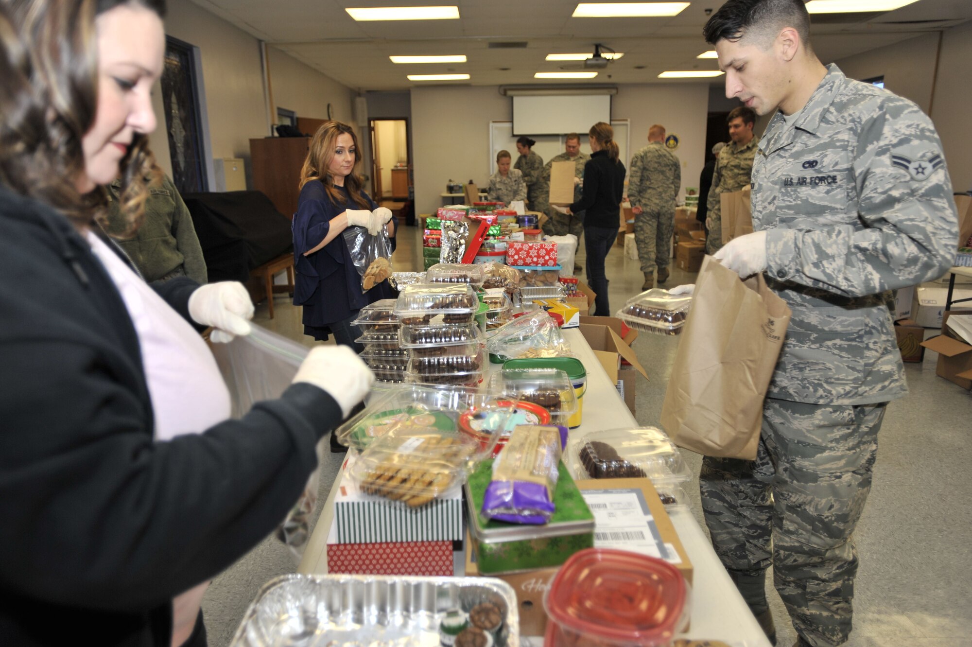 Shower Shaw with Cookies volunteers prepare cookies to be delivered to dorm Airmen during the annual cookie drive at Shaw Air Force Base, S.C., Dec. 7, 2017.