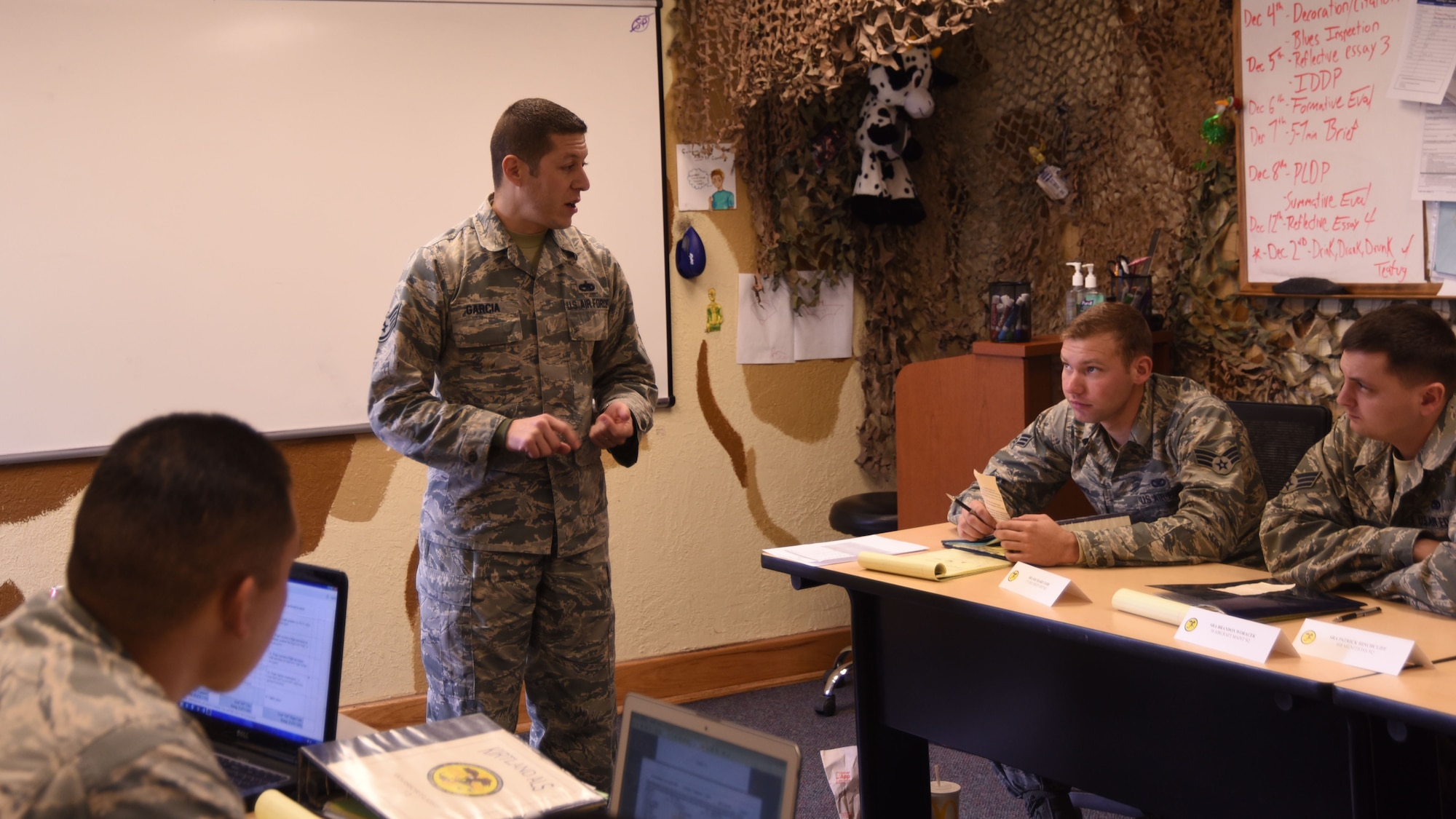 Staff Sgt. Nicholas Garcia, Airman Leadership School flight instructor, explains the drill and ceremonies evaluation to his flight at Kirtland Air Force Base, Nov. 30. A typical class at ALS is six weeks long, or 27 training days.