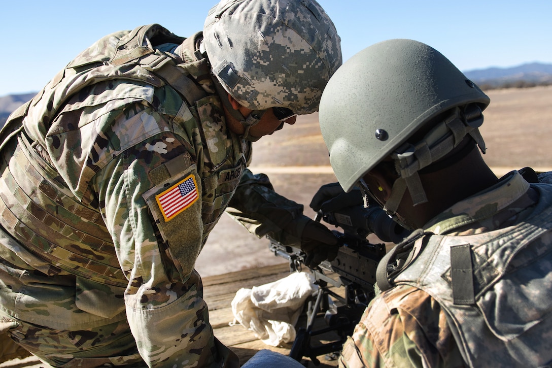 Army Reserve Pfc. Ricardo Ramirez, left, and Spc. Cathier Ossiri mount an AN/PAS-13 thermal weapon sight.