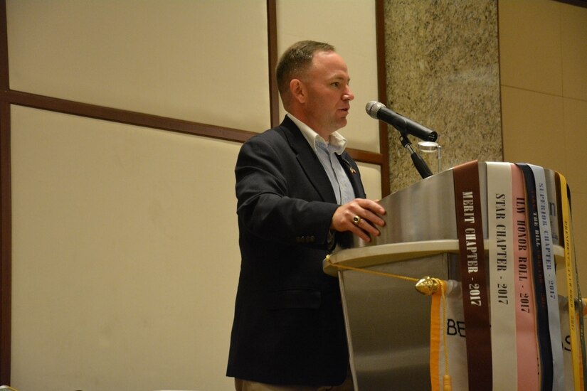 Man at a podium giving a speech