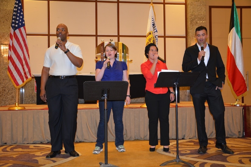 Four singers performing.