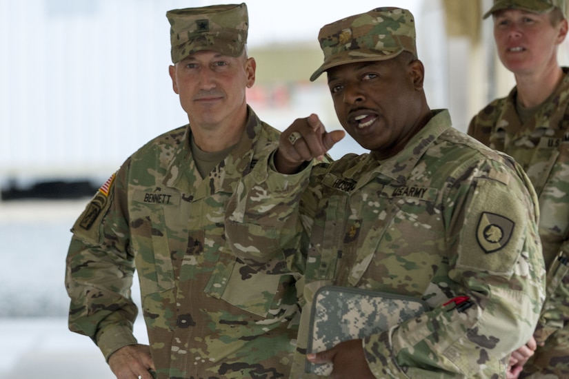 Two male Soldiers talking.