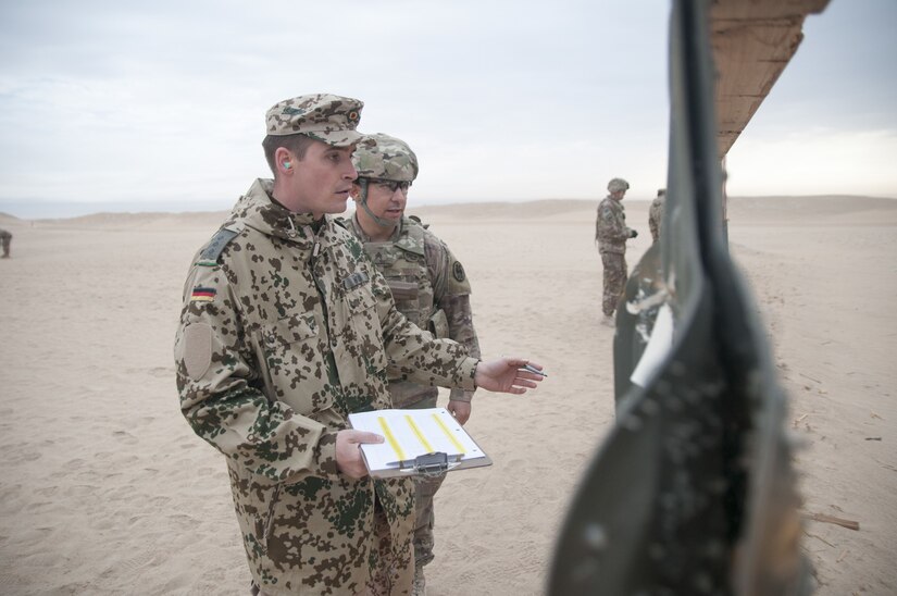 Soldiers inspecting a wall