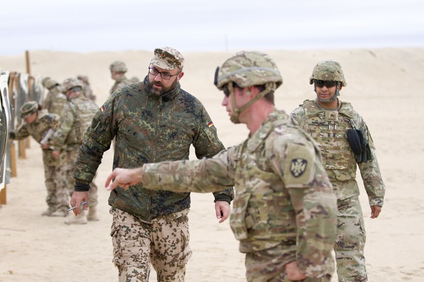 Soldiers review pistol qualification performance.