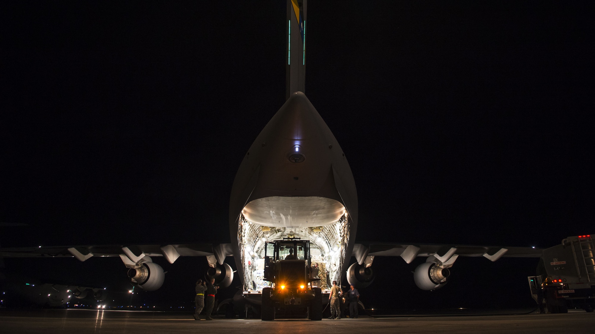 A C-17 Globemaster III sits on the flightline while food and water are offloaded Sept. 24, 2017, at St. Croix, U.S. Virgin Islands.