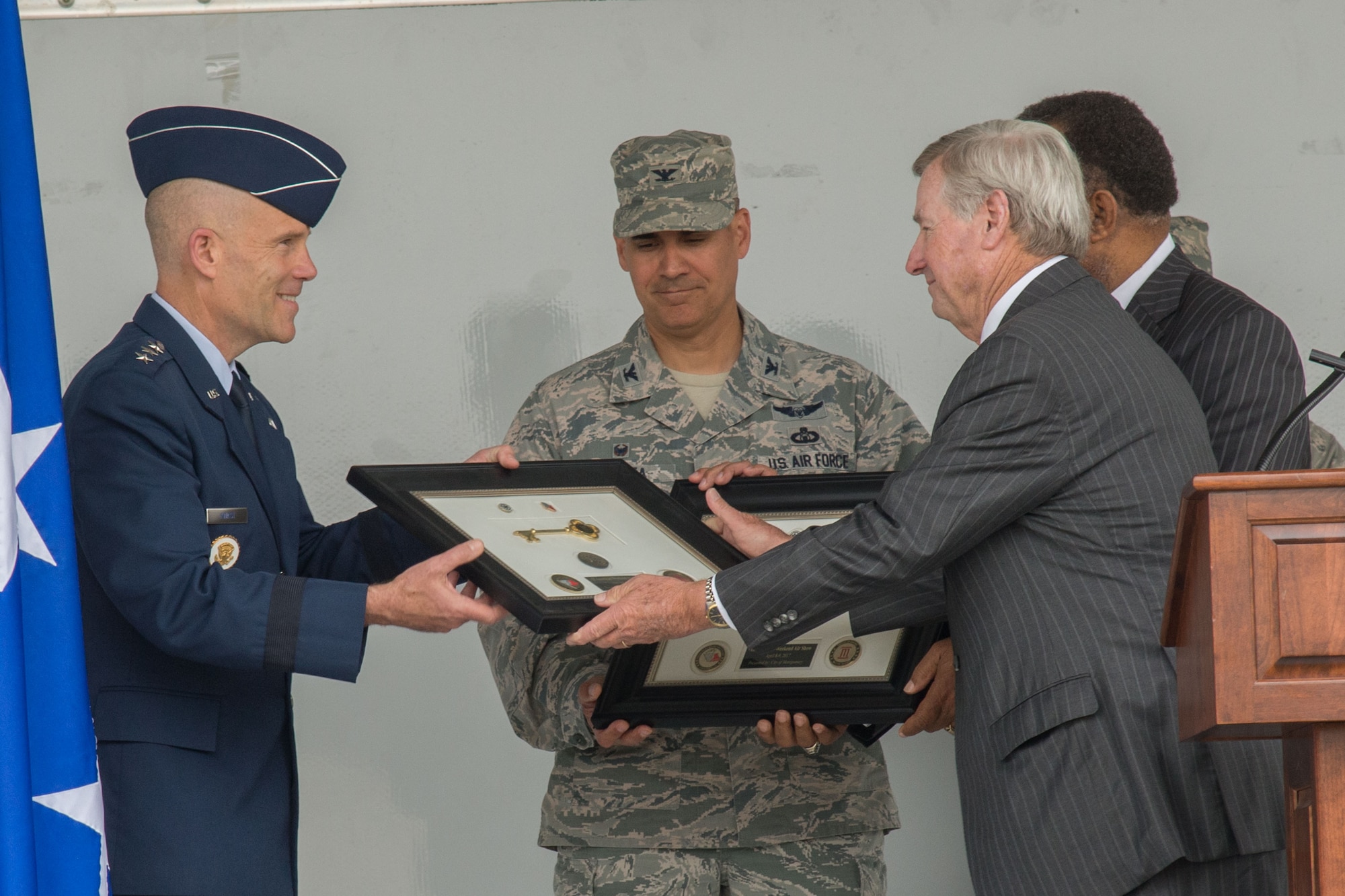 Montgomery Mayor Todd Strange presents the Keys to the City to Lt. Gen. Steven Kwast, Air University commander, and Col. Eric Shafa, 42nd Air Base Wing commander, April 17, 2017. The mayor presented the keys as a show of appreciation for the Maxwell Air Force Base “Heritage to Horizon” Air Show, April 8-9, 2017. The International Council of Air Shows awarded Maxwell the Dick Schram Memorial Community Relations Award for having the best air show in 2017. (U.S. Air Force photo by Trey Ward)