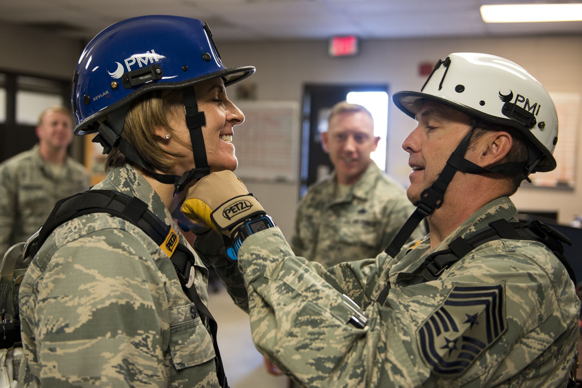 Chief Master Sgt. Jarrod Sebastian, right, 23d Wing command chief, adjusts Col. Jennifer Short’s, 23d Wing commander, helmet before they climb a radio antenna tower as part of an immersion tour, Dec. 11, 2017, at Moody Air Force Base, Ga. Moody leadership visited the radar, airfield and weather systems facility to familiarize themselves with the 23d Operations Support Squadron’s duties and to gain a better understanding of how they impact the mission. (U.S. Air Force photo by Airman 1st Class Erick Requadt)