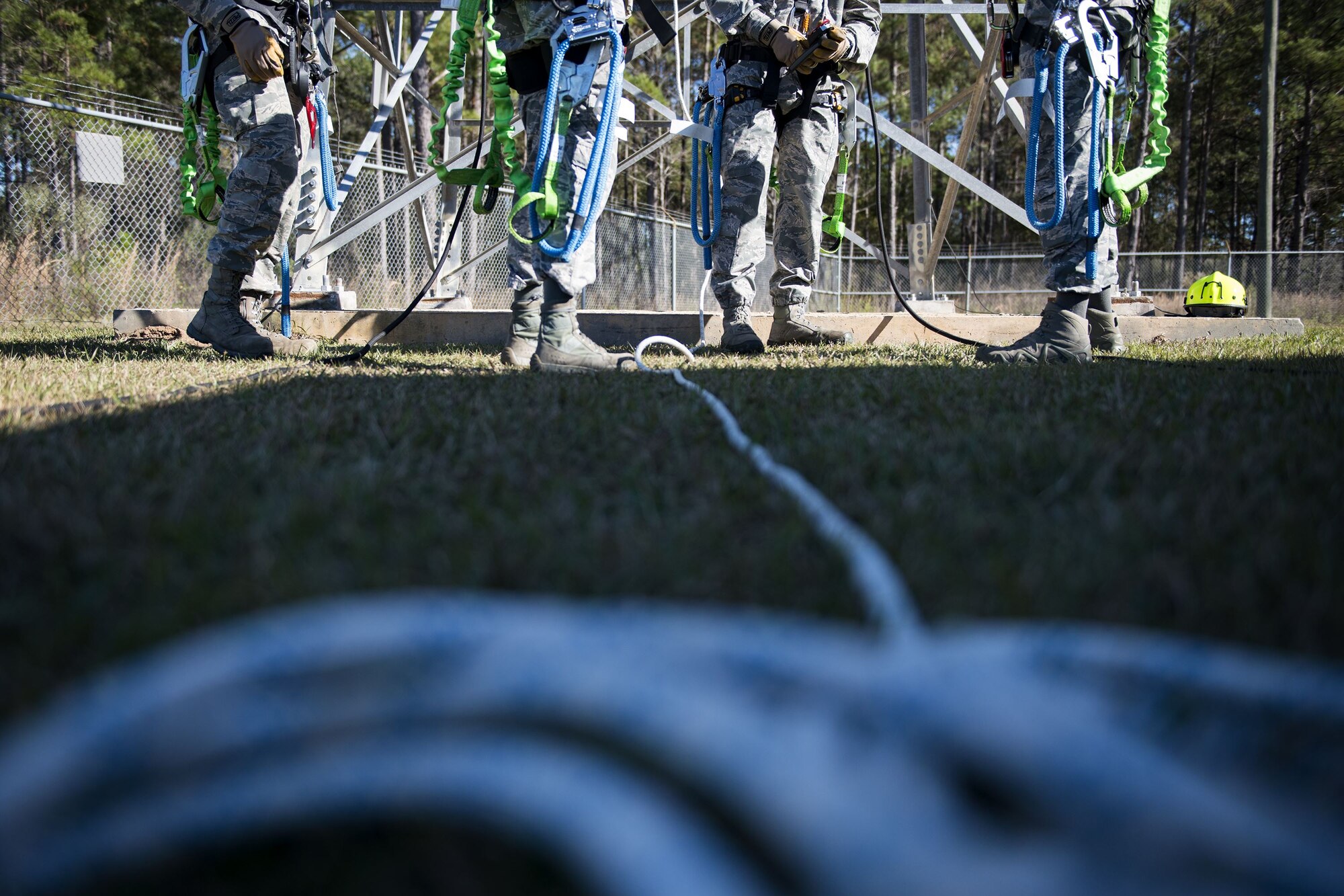 Team Moody Airmen get ready to climb a radio antenna tower during an immersion tour, Dec. 11, 2017, at Moody Air Force Base, Ga. Moody leadership visited the radar, airfield and weather systems facility to familiarize themselves with the 23d Operations Support Squadron’s duties and to gain a better understanding of how they impact the mission. (U.S. Air Force photo by Airman 1st Class Erick Requadt)