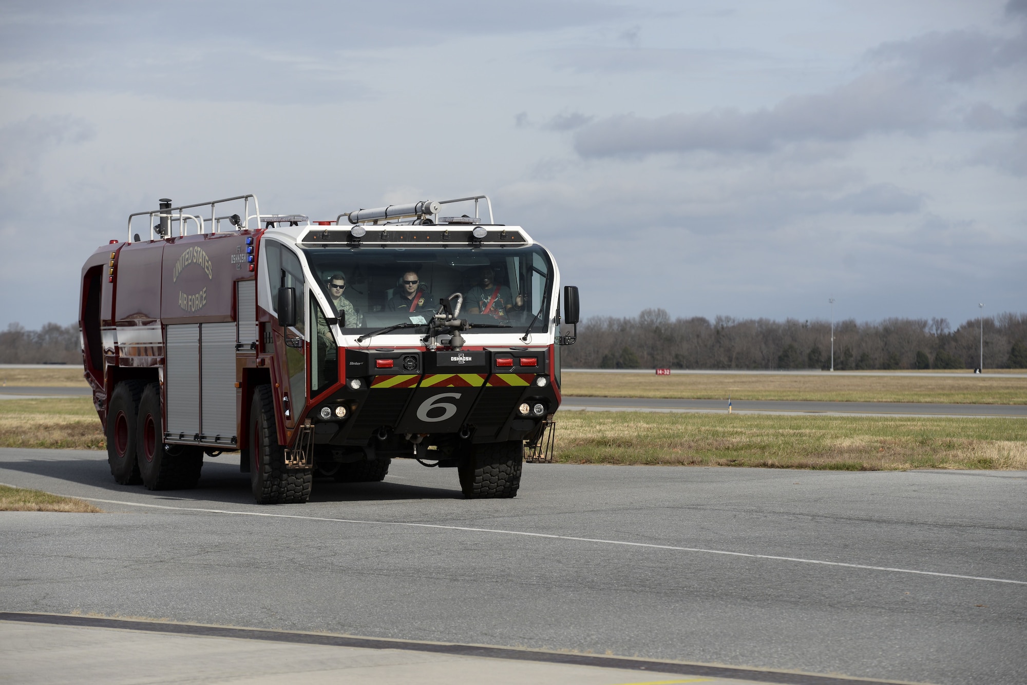 Professional athlete, Herschel Walker, rides in a crash truck Dec. 5, 2017, on the flightline at Dover Air Force Base, Del. Walker visited with Airmen from the 436th Maintenance Group, Mission Support Group, Operations Group and Medical Group, as well as the Total Force members of the Armed Forces Medical Examiner System, the Air Force Mortuary Affairs Operations and the Joint Personal Effects Depot. (U.S. Air Force photo by Staff Sgt. Aaron J. Jenne)