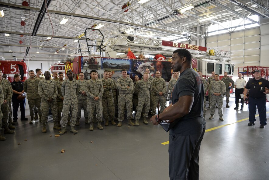 Professional athlete, Herschel Walker, speaks with Airmen of the 436th Civil Engineer Squadron Dec. 5, 2017, at the fire department on Dover Air Force Base, Del. Walker answered questions about his football career and struggles with mental health. (U.S. Air Force photo by Staff Sgt. Aaron J. Jenne)