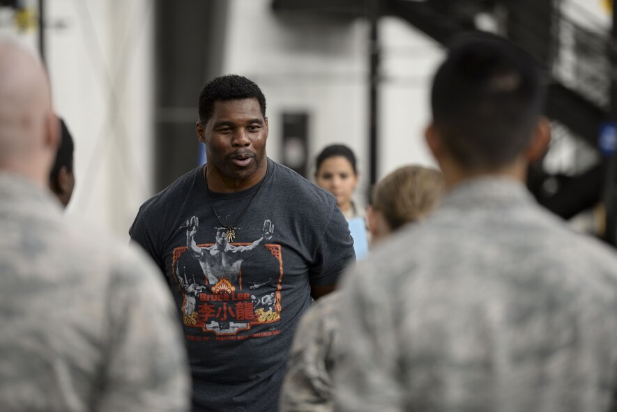 Professional athlete, Herschel Walker, speaks to Airmen Dec. 5, 2017, at the 436th Aerial Port Squadron on Dover Air Force Base, Del. Walker shared stories of his personal struggle with mental health and told the Airmen it’s ok to seek help. (U.S. Air Force photo by Staff Sgt. Aaron J. Jenne)