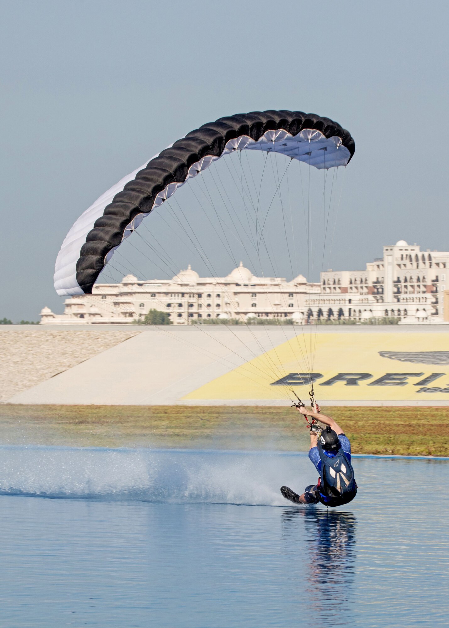 Maj. Matthew Shull, 6th Space Operations Squadron, performs a move called "blindman" at a freestyle event following the 9th World Cup of Canopy Piloting competition in Dubai, United Arab Emirates, Dec. 1, 2017.