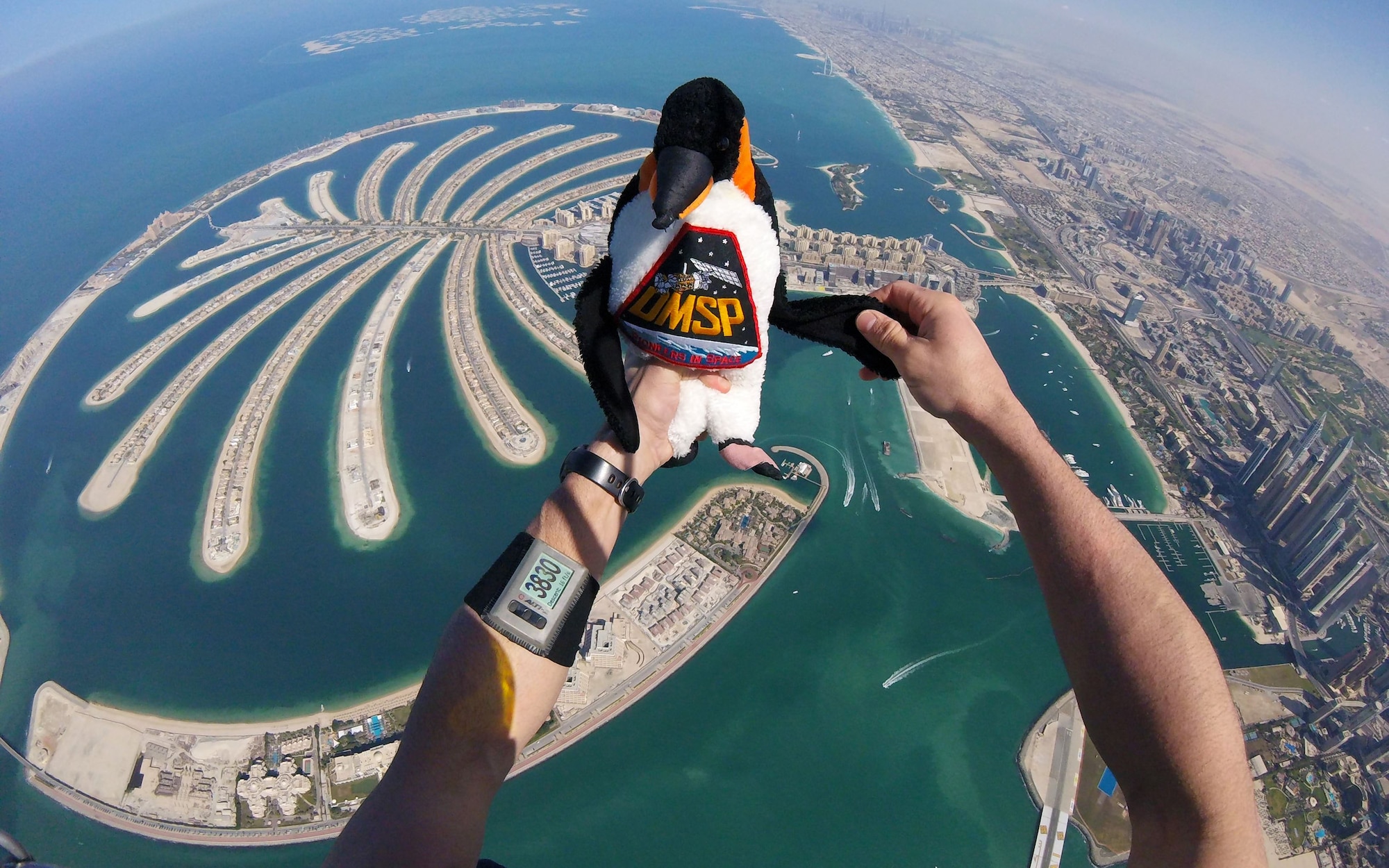 Maj. Matthew Shull, 6th Space Operations Squadron, takes the DMSP (Defense Meteorological Satellite Program) mascot for a flight during the 9th World Cup of Canopy Piloting event in Dubai, United Arab Emirates, Dec. 1, 2017.