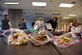 The Officers’ Spouses’ Club partner with the Enlisted Spouses’ Club for the annual Operation Cookie Drop at the base chapel Dec. 11, 2017, at Fairchild Air Force Base, Washington. Officer and enlisted spouses provided dozens of homemade cookies, filling over 600 bags for Airmen living in the dorms. (U.S. Air Force photo/Airman Whitney Laine)