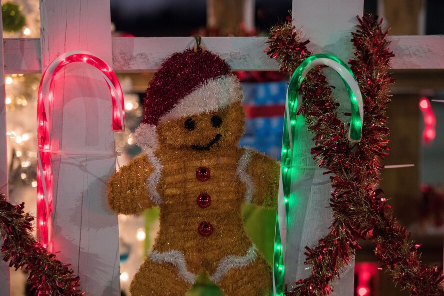 Christmas decorations hang on the side of a float during the holiday parade and tree lighting ceremony Dec. 7, 2017, at Cannon Air Force Base, New Mexico. The floats were made by various squadrons on base. (U.S. Air Force photo by Staff Sgt. Michael Washburn/Released)