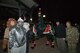 Members of the 27th Special Operations Support Squadron pose for a photo after receiving an award for best overall float during the holiday parade and tree lighting ceremony Dec. 7, 2017, at Cannon Air Force Base, New Mexico. Col. Michael Conley, 27th Special Operations Wing vice commander, handed out awards for best light display, most spirited float and best overall float. (U.S. Air Force photo by Staff Sgt. Michael Washburn/Released)