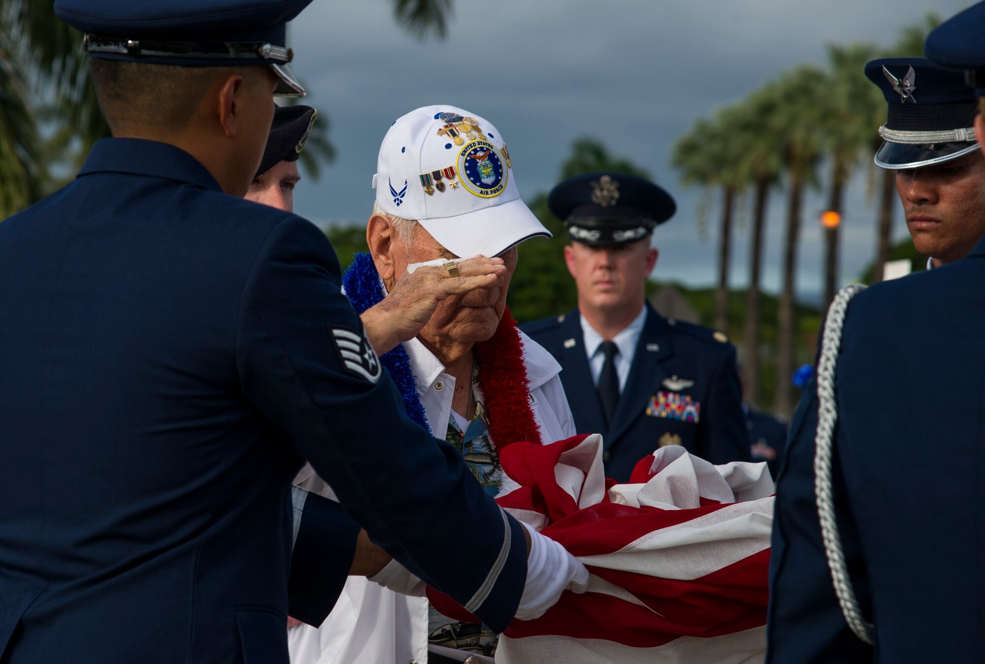 Former Tech. Sgt. Durward Swanson salutes the U.S. flag during a retreat ceremony.
