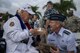 Former Tech. Sgt. Durward Swanson gives a plaque to Gen. Terrence O'Shaughnessy, Pacific Air Forces commander.