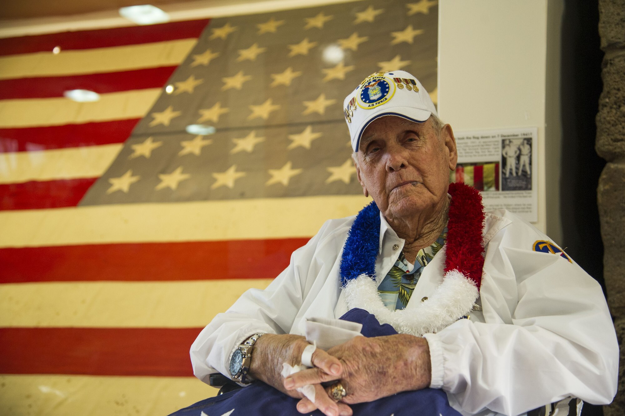 Former Tech. Sgt. Swanson poses for a photo in front of the U.S. flag.