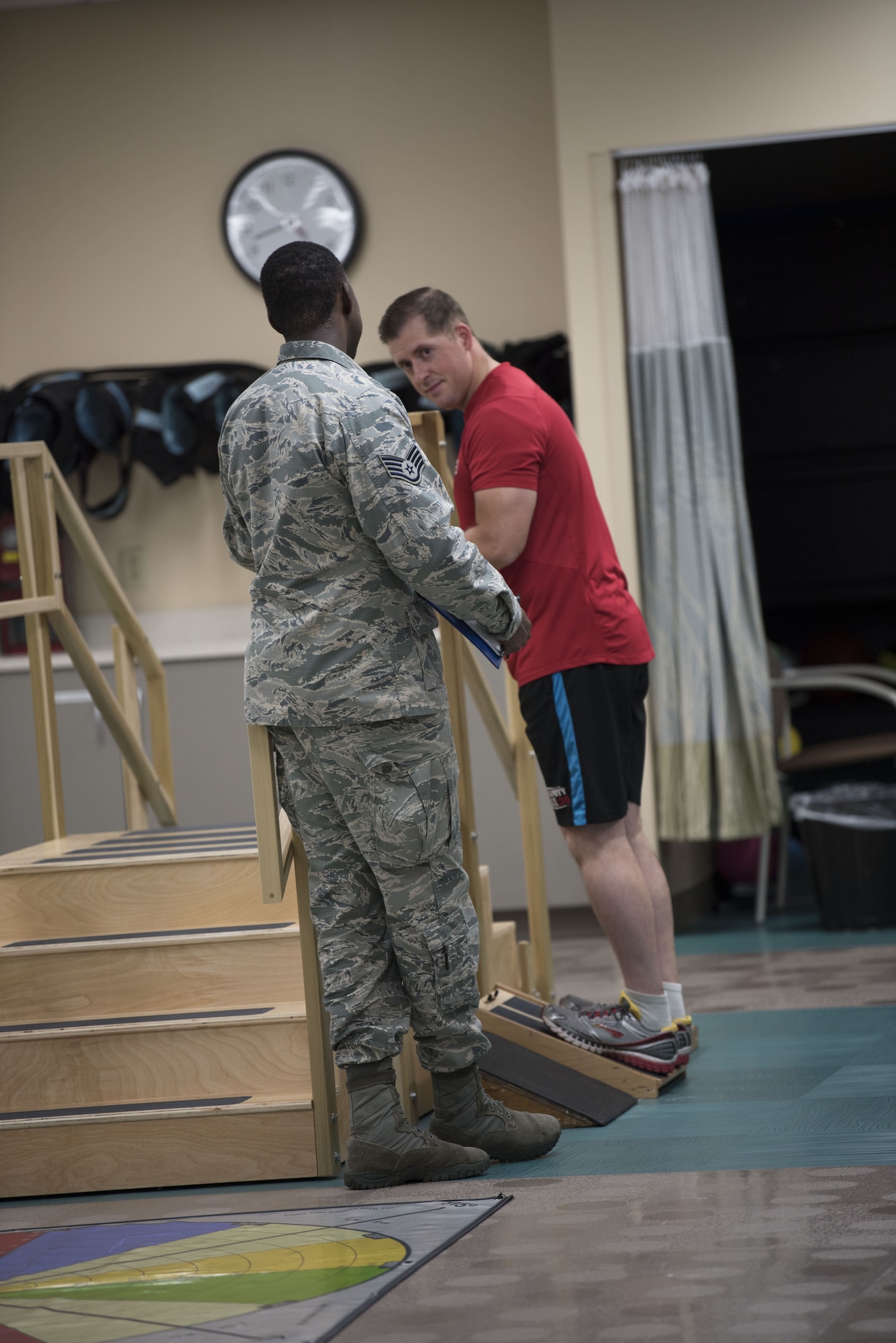 Staff Sgt. Christian J. Taylor, 60th Medical Operations physical medicine technician, directs his patient Tech. Sgt. James Hodgman, 60th Air Mobility Wing Public Affairs NCO in charge of command information, at the physical therapy clinic inside David Grant USAF Medical Center at Travis Air Force Base, Calif., Nov. 27, 2017. The physical therapy clinic is comprised of dedicated professionals who specialize in providing care for musculoskeletal disorders and movement dysfunction. (U.S. Air Force photo by Airman 1st Class Jonathon D. A. Carnell)