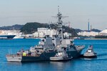 TOKYO BAY, Japan (Dec. 13, 2017) - The Arleigh Burke-class guided-missile destroyer USS John S. McCain (DDG 56) is towed to the pier at Fleet Activities (FLEACT) Yokosuka. John S. McCain will undergo repairs at Ship Repair Facility – Japan Regional Maintenance Center in Yokosuka.