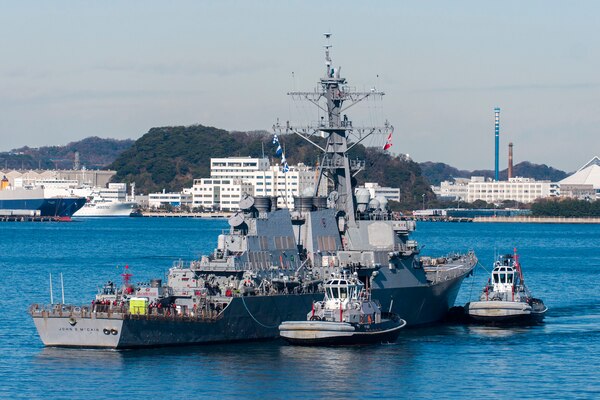 TOKYO BAY, Japan (Dec. 13, 2017) - The Arleigh Burke-class guided-missile destroyer USS John S. McCain (DDG 56) is towed to the pier at Fleet Activities (FLEACT) Yokosuka. John S. McCain will undergo repairs at Ship Repair Facility – Japan Regional Maintenance Center in Yokosuka.