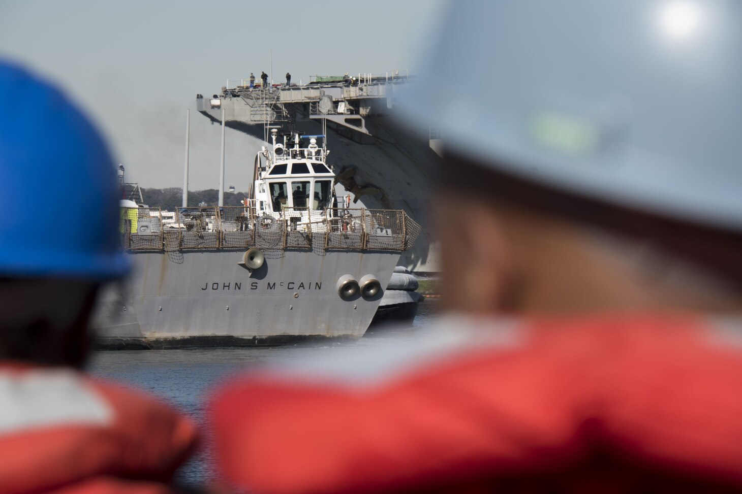 TOKYO BAY, Japan (Dec. 13, 2017) - The Arleigh Burke-class guided-missile destroyer USS John S. McCain (DDG 56) is towed to the pier at Fleet Activities (FLEACT) Yokosuka. John S. McCain will undergo repairs at Ship Repair Facility – Japan Regional Maintenance Center in Yokosuka.