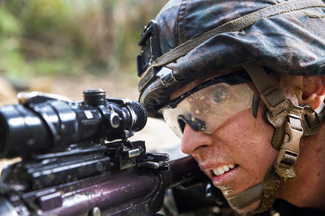 Navy Petty Officer 1st Class Holden Hartley provides security.