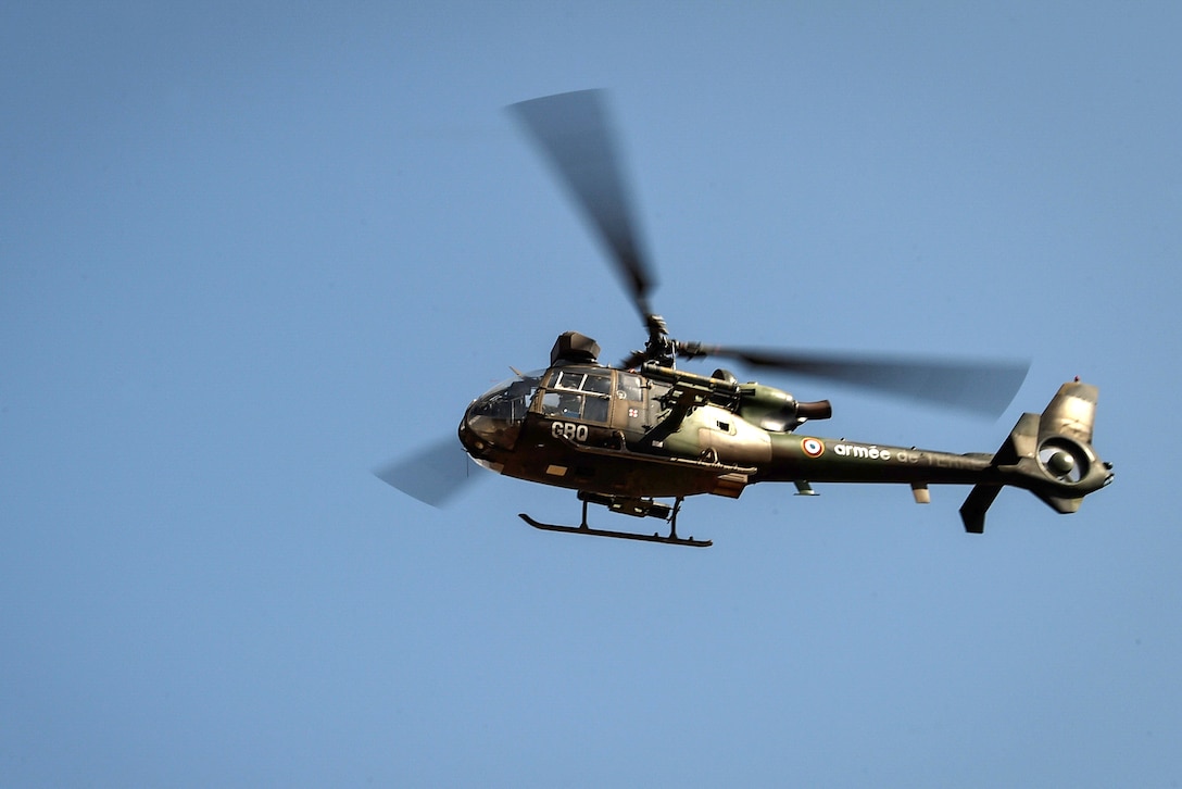 A French military Aerospatiale Gazelle helicopter conducts close air combat attacks.