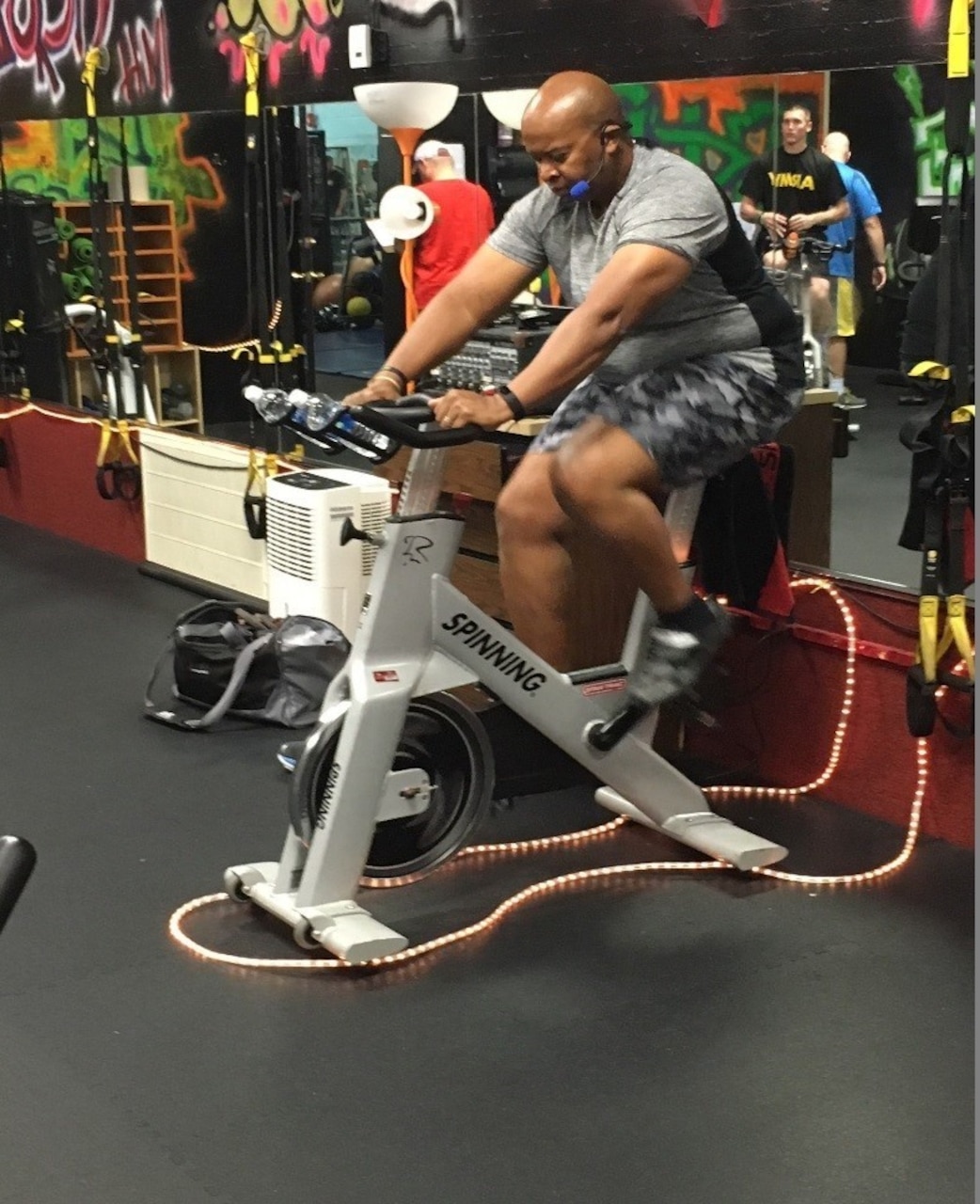 A soldier works out on a stationary bike