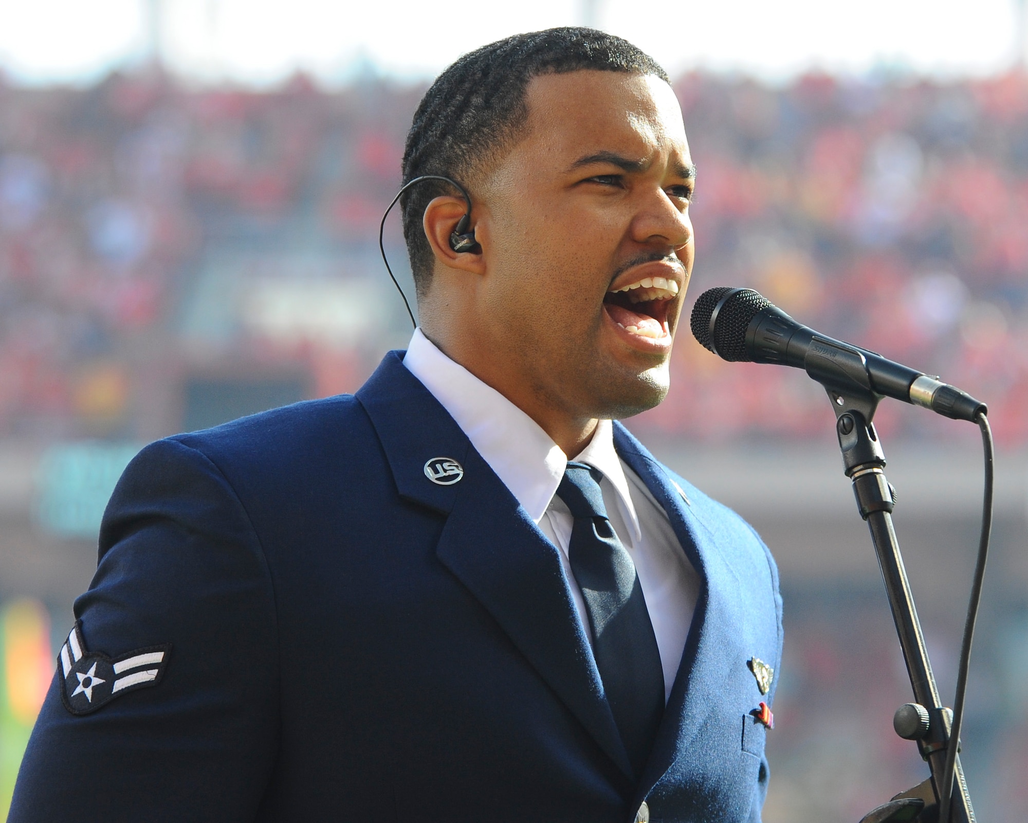 An Airman sings