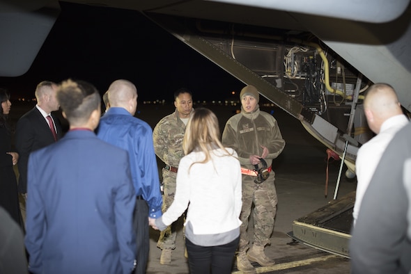 Cannon Office of Special Investigation agents and local police department officers tour a CV-22 Osprey at Cannon Air Force Base, New Mexico, Dec. 8, 2017. The tour brought both parties together during the holiday season. (U.S. Air Force photo by Senior Airman Lane T. Plummer)
