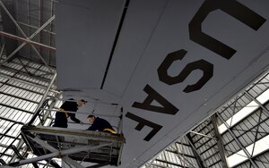 Tech Sgt. Chris Kalif, left, and Staff Sgt. Erin Winkler, right, both 437th Aircraft Maintenance Squadron aerospace maintenance craftsmen, perform ground maintenance on a C-17 Globemaster III in preparation for a Joint Forcible Entry training event in support of the U.S. Air Force Weapons School Integration phase Dec. 8. Thirty seven C-17s, 21 C-130 Hercules and 120 U.S. Army paratroopers participated in the mobility portion of the WSINT phase during a simulated mass JFE event over a contested target Dec. 9, on a range near Nellis Air Force Base, Nev. The event demonstrates the U.S. Air Force’s ability to execute rapid, decisive responses to crises worldwide.