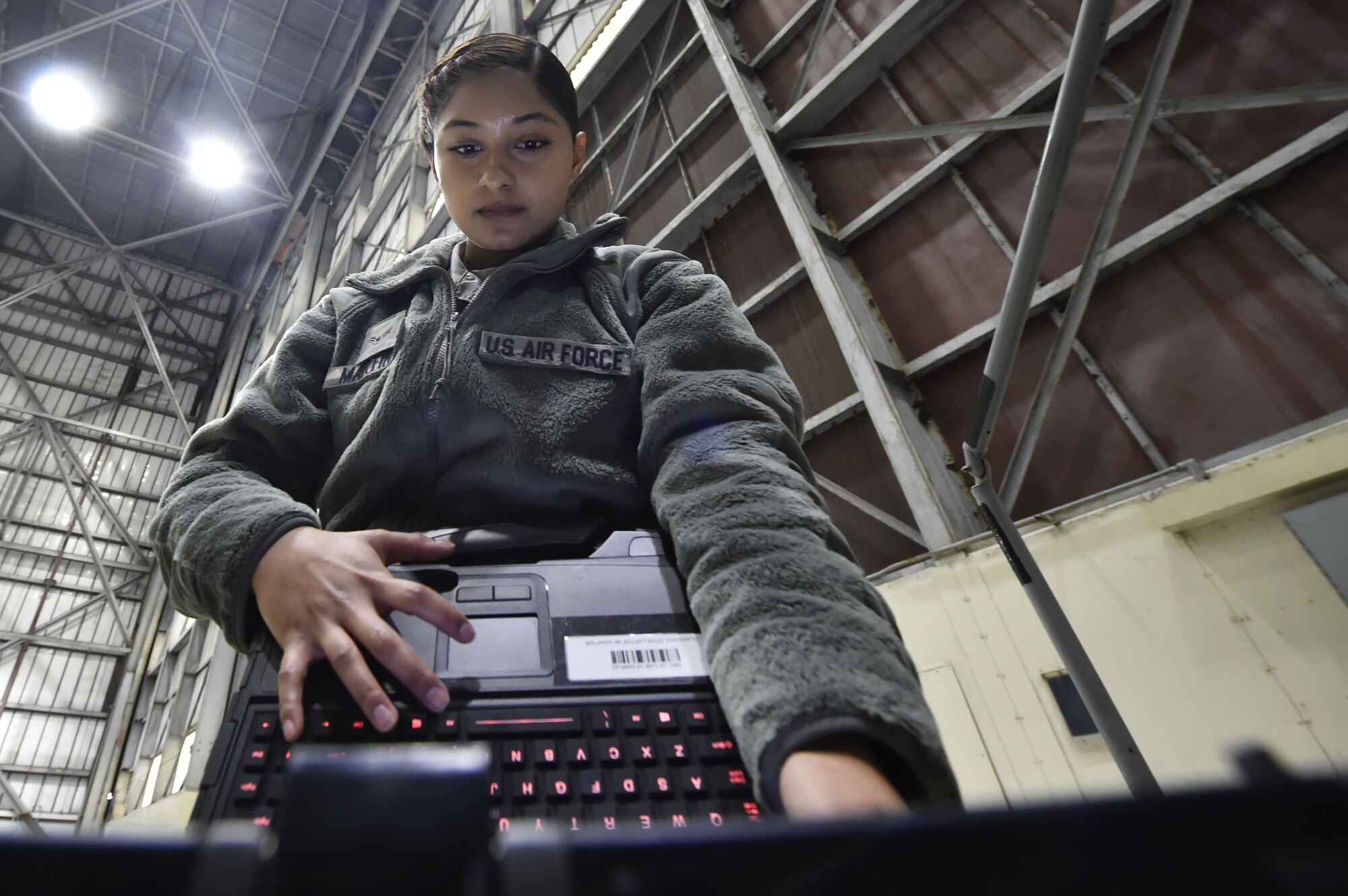 Airman 1st Class Yasuary Martinez, 437th Aircraft Maintenance Squadron aerospace maintenance journeyman, performs ground maintenance on a C-17 Globemaster III in preparation for a Joint Forcible Entry training event in support of the U.S. Air Force Weapons School Integration phase Dec. 8. Thirty seven C-17s, 21 C-130 Hercules and 120 U.S. Army paratroopers participated in the mobility portion of the WSINT phase during a simulated mass JFE event over a contested target Dec. 9, on a range near Nellis Air Force Base, Nev. The event demonstrates the U.S. Air Force’s ability to execute rapid, decisive responses to crises worldwide.