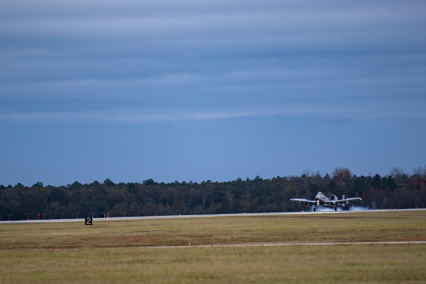 An A-10C Thunderbolt II touches down on the flightline, Dec. 8, 2017, at Moody Air Force Base, Ga. Team Moody uses this style of refueling to eliminate the need of extra maintenance and to extend pilot’s training time per flight. (U.S. Air Force photo by Senior Airman Daniel Snider)