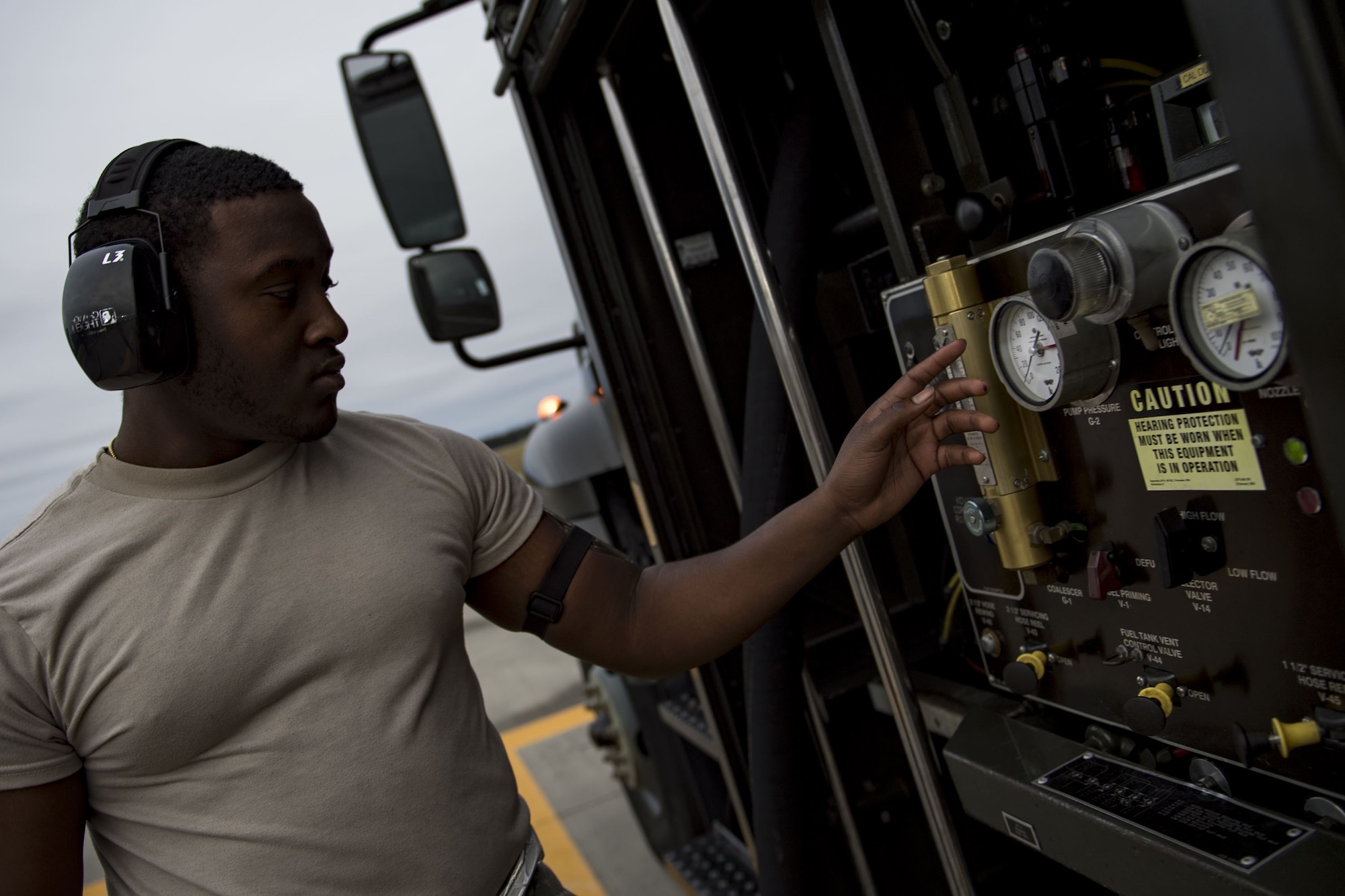 Airman 1st Class Ramauro Bey, 23d Logistics Readiness Squadron fuels distribution operator, monitors the settings on a R-11 refueling truck during a hot-pit refuel of an A-10C Thunderbolt II, Dec. 8, 2017, at Moody Air Force Base, Ga. Team Moody uses this style of refueling to eliminate the need of extra maintenance and to extend pilot’s training time per flight. (U.S. Air Force photo by Senior Airman Daniel Snider)