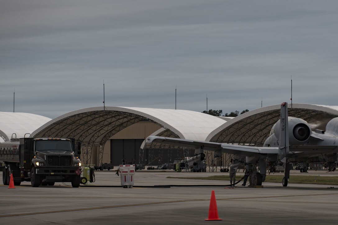Members of the 23d Logistics Readiness Squadron fuels distribution shop refuel an A-10C Thunderbolt II during a hot-pit refuel, Dec. 8, 2017, at Moody Air Force Base, Ga. Team Moody uses this style of refueling to eliminate the need of extra maintenance and to extend pilot’s training time per flight. (U.S. Air Force photo by Senior Airman Daniel Snider)