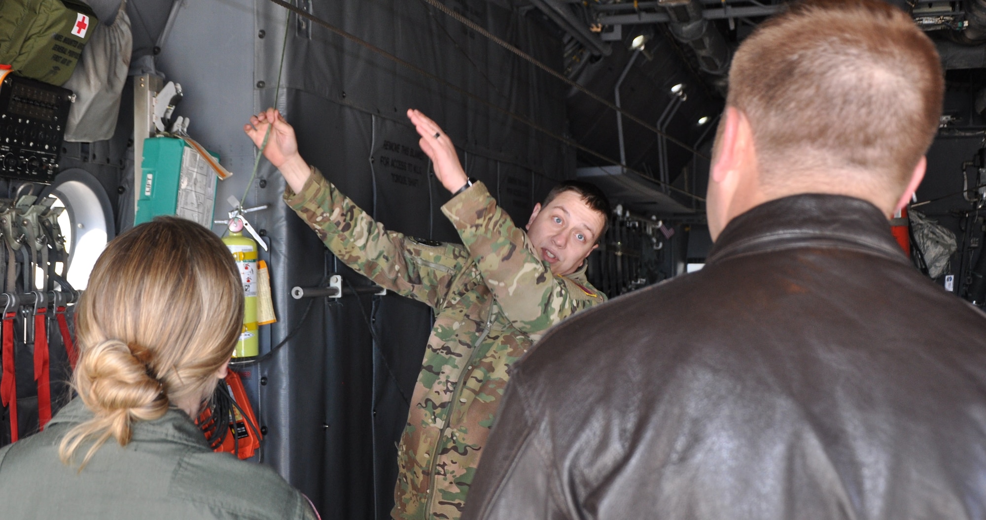 Staff Sgt. David Metroka, a C-130H loadmaster with the 700th Airlift Squadron, Dobbins, Air Reserve Base, Georgia, shows loadmasters from the 731st Airlift Squadron the towed parachute retrieval system during the loadmaster refresher course, Nov. 18 at Peterson Air Force Base, Colorado. (U.S. Air Force photo/Daniel Butterfield)