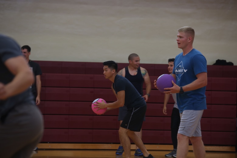 A Marine and his teammates take part in a dodgeball tournament as part of the SEMPERFIT Summer Challenge aboard Marine Corps Recruit Depot Parris Island, August 8. The summer challenge is a program that promotes a healthy, active lifestyle and builds unit cohesion.