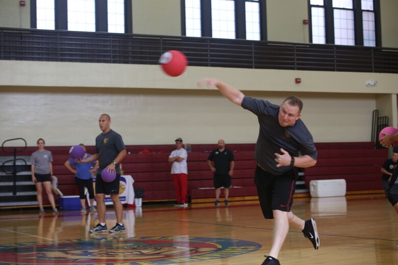 A Marine and his teammates take part in a dodgeball tournament as part of the SEMPERFIT Summer Challenge aboard Marine Corps Recruit Depot Parris Island, August 8. The summer challenge is a program that promotes a healthy, active lifestyle and builds unit cohesion.