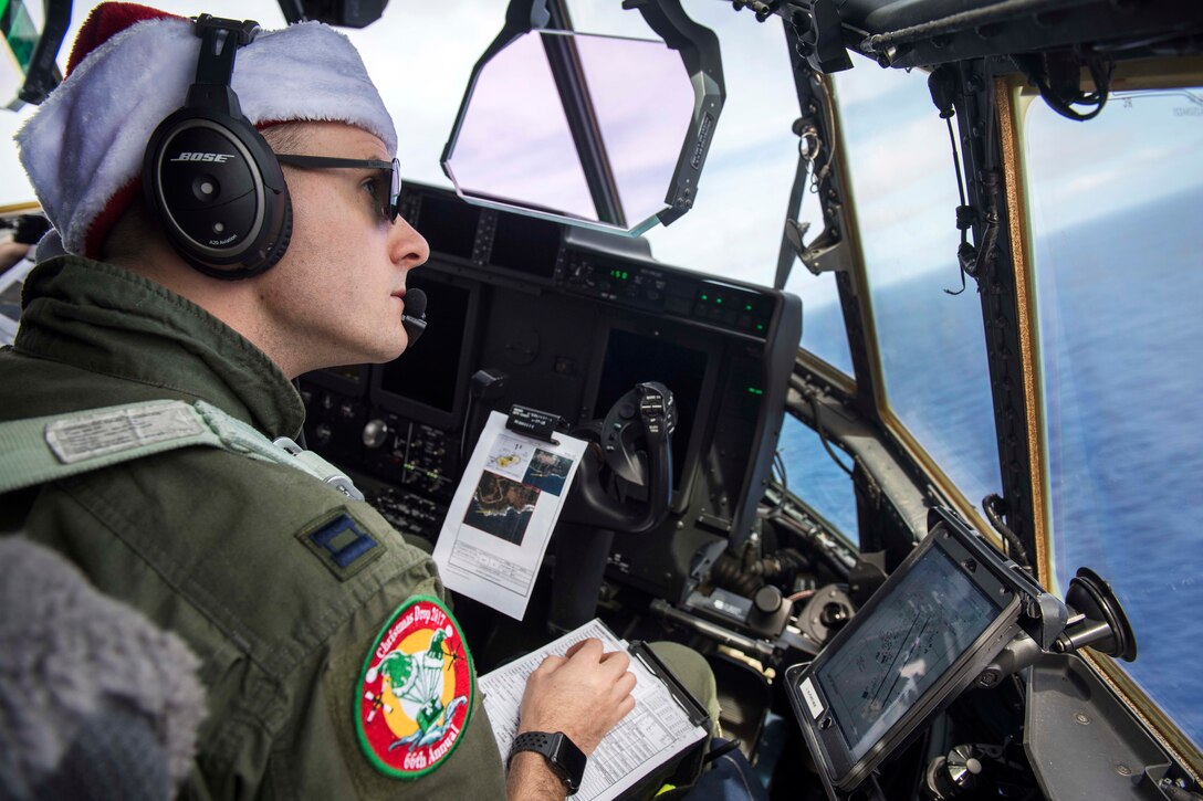 Air Force Capt. Lionel Alford flies a C-130J Super Hercules over Andersen Air Force Base.