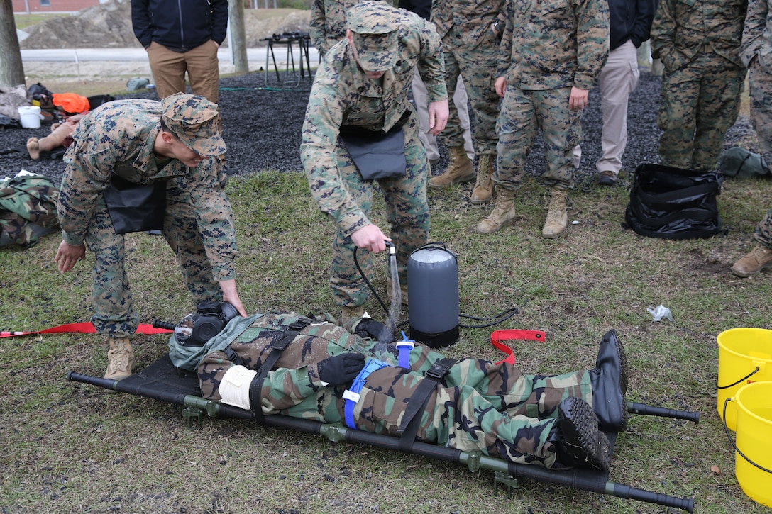 Marines and Sailors with U.S. Marine Corps Forces, Special Operations Command, decontaminate a simulated chemical contact victim, Dec. 6, 2017, during a training event aboard Marine Corps Base Camp Lejeune, N.C., for the management and care of casualties following a chemical or biological weapons attack. Long prohibited by international agreements, chemical weapons have been increasingly used on the battlefield by American adversaries including violent extremist organizations. Raiders gained valuable practical application skills in handling casualties in complex and dangerous chemical environments. (U.S. Marine Corps photo by Sgt. Salvador R. Moreno, released)