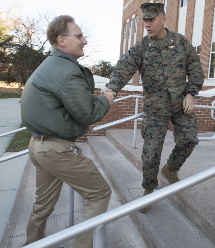 The Honorable Thomas B. Modly, Under Secretary of the Navy, shakes hands with Col. Eric E. Austin, deputy commander, U.S. Marine Corps Forces Command, during his visit at MARFORCOM headquarters, Naval Support Activity Hampton Roads, Norfolk, Va., Dec. 13. Under Secretary Modly received a briefing on operations and mission readiness from command staff. (Official U.S. Marine Corps photo by Chris Jones/Released)