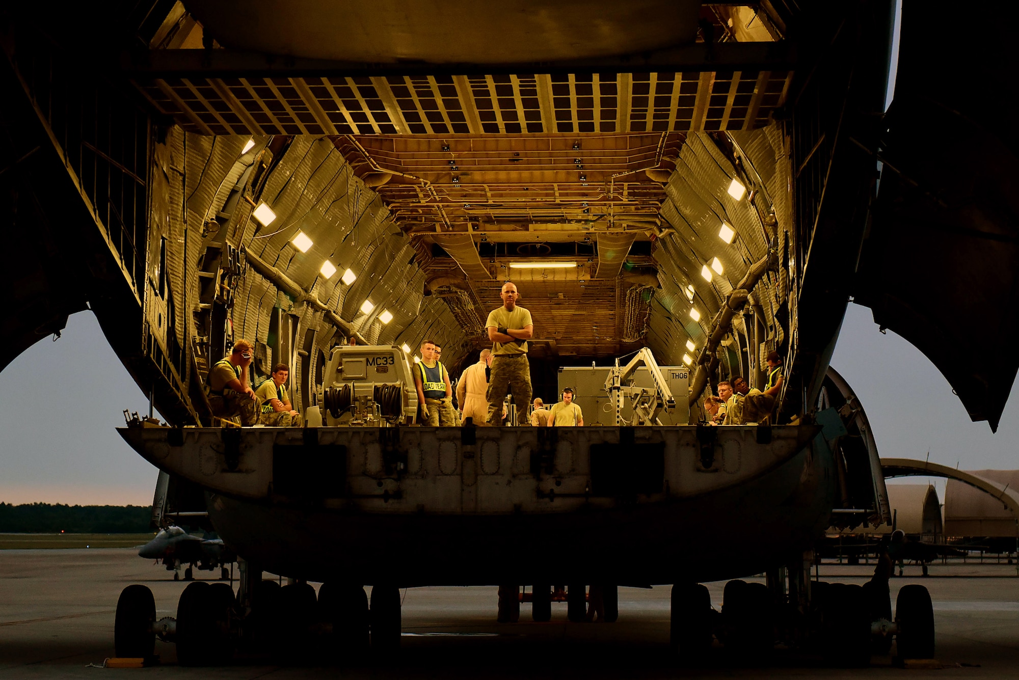 Staff Sgt. Richard Averitt, 4th Logistics Readiness Squadron air transportation specialist, waits for cargo to be loaded on a C-5M Super Galaxy, Sept. 29, 2017, at Seymour Johnson AFB, North Carolina. The 4th LRS provides worldwide logistics support for the 4th Fighter Wing. (U.S. Air Force photo by Airman 1st Class Victoria Boyton)