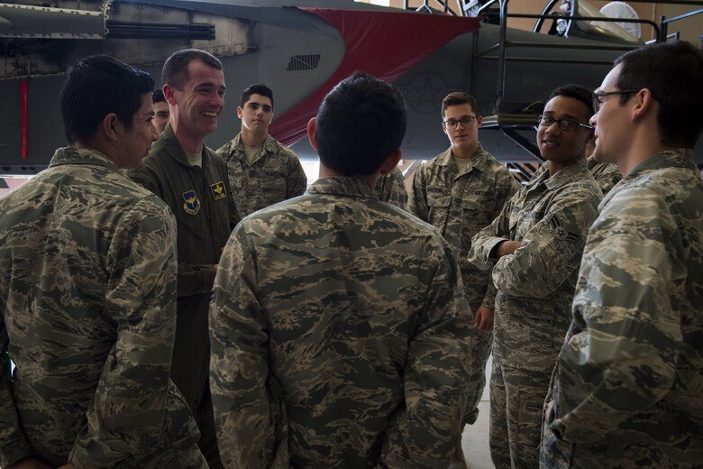 A pilot mentors Airmen.