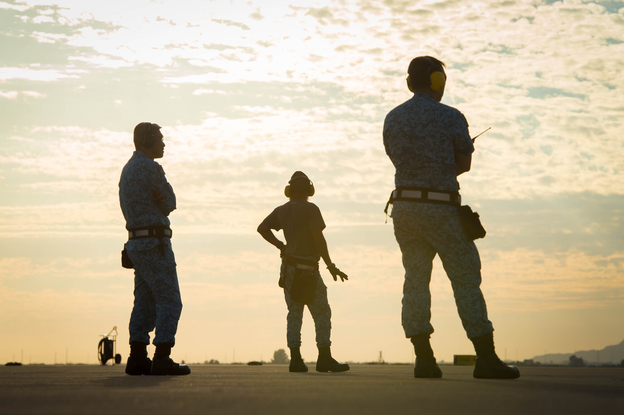 Republic of Singapore Airmen wait for an F-15SG Eagle, assigned to the 428th Fighter Squadron, to taxi off the runway at Luke Air Force Base, Ariz., Dec. 2, 2017. The 428th FS, from Mountain Home Air Force Base, Idaho, participated in Exercise Forging Sabre which included the launch and recovery of several F-15s. (U.S. Air Force photo/Staff Sgt. Jensen Stidham)